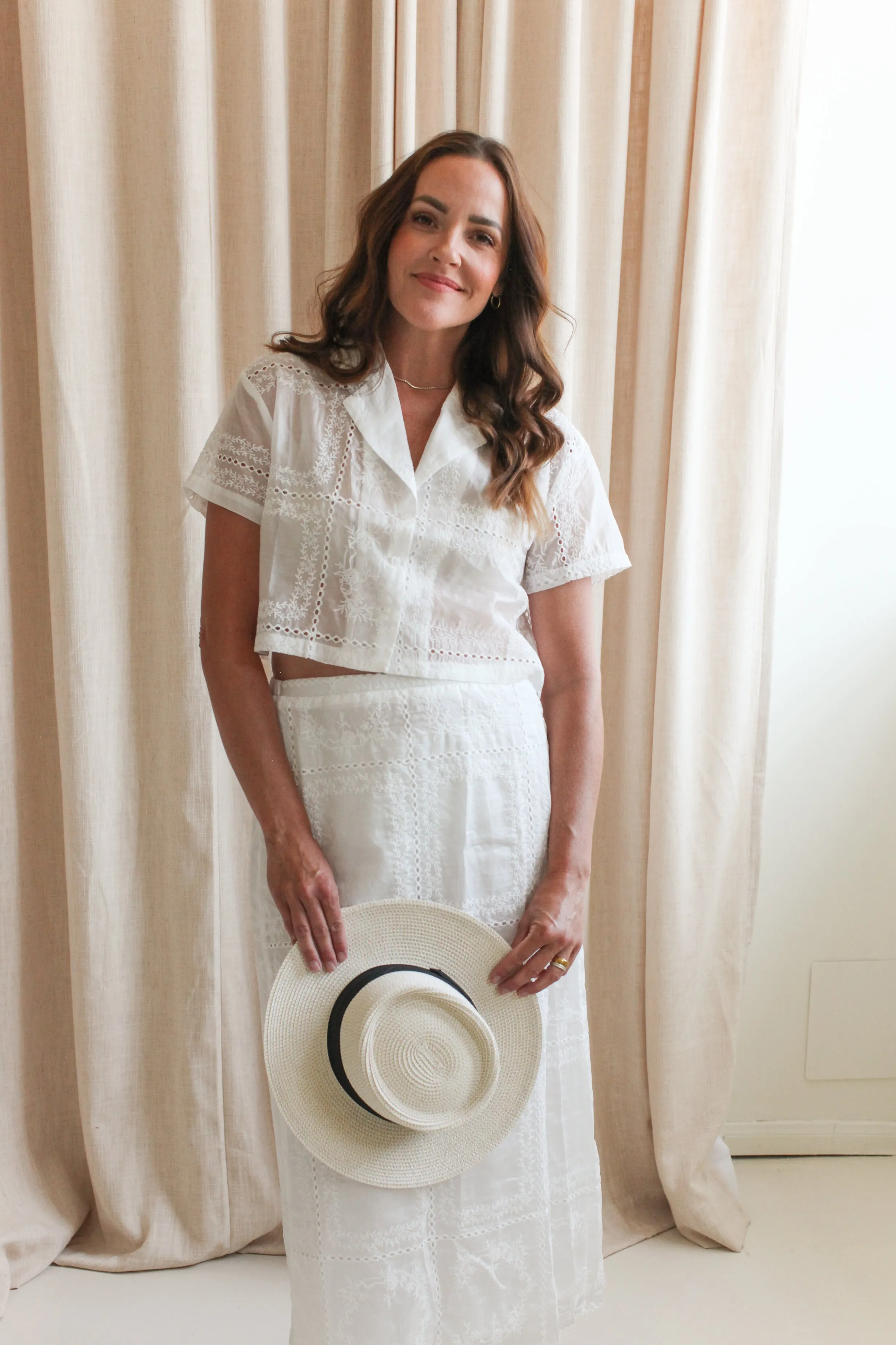 Carina Eyelet Midi Skirt snug fit
